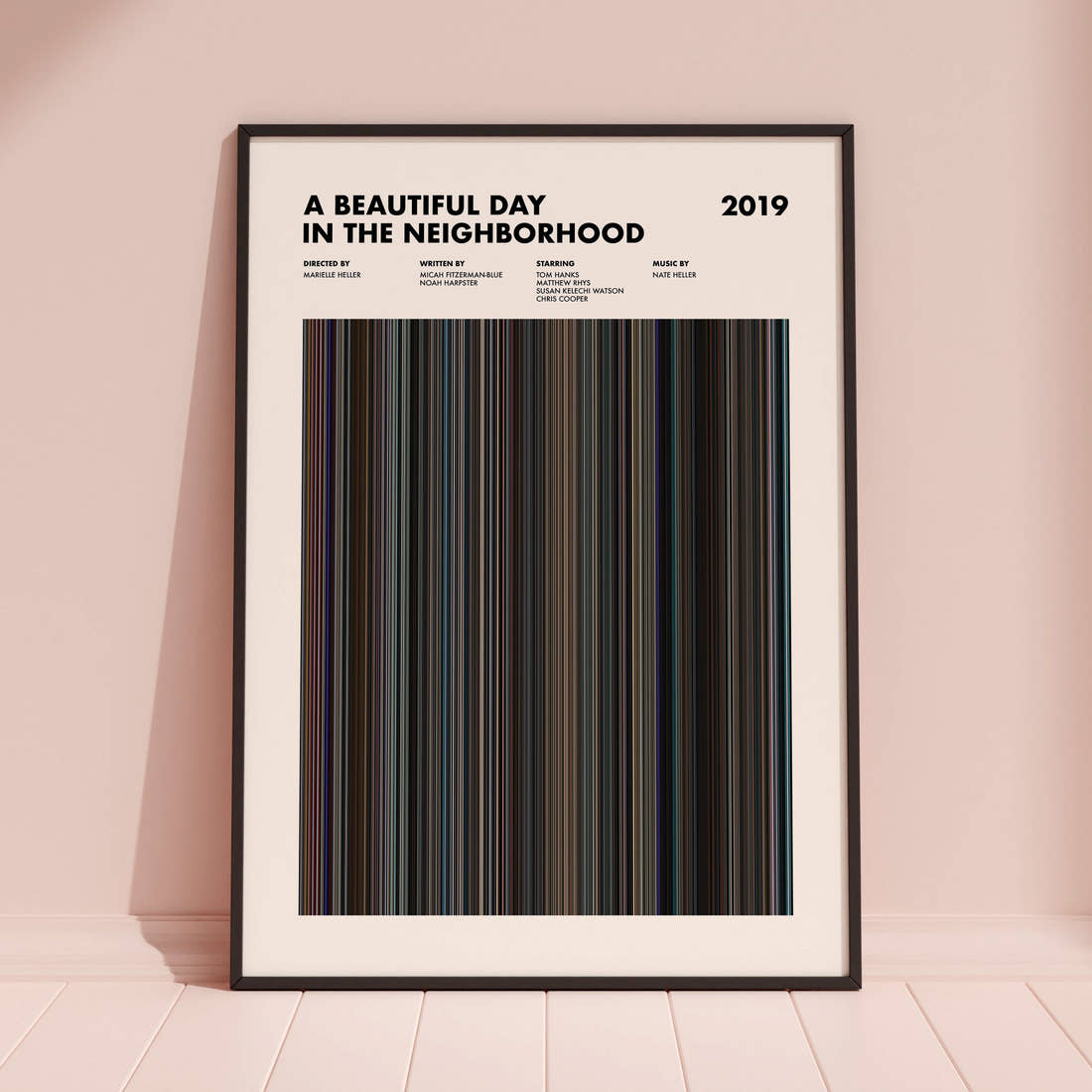 A Beautiful Day in the Neighborhood Movie Barcode Poster framed and leaning against a coloured wall