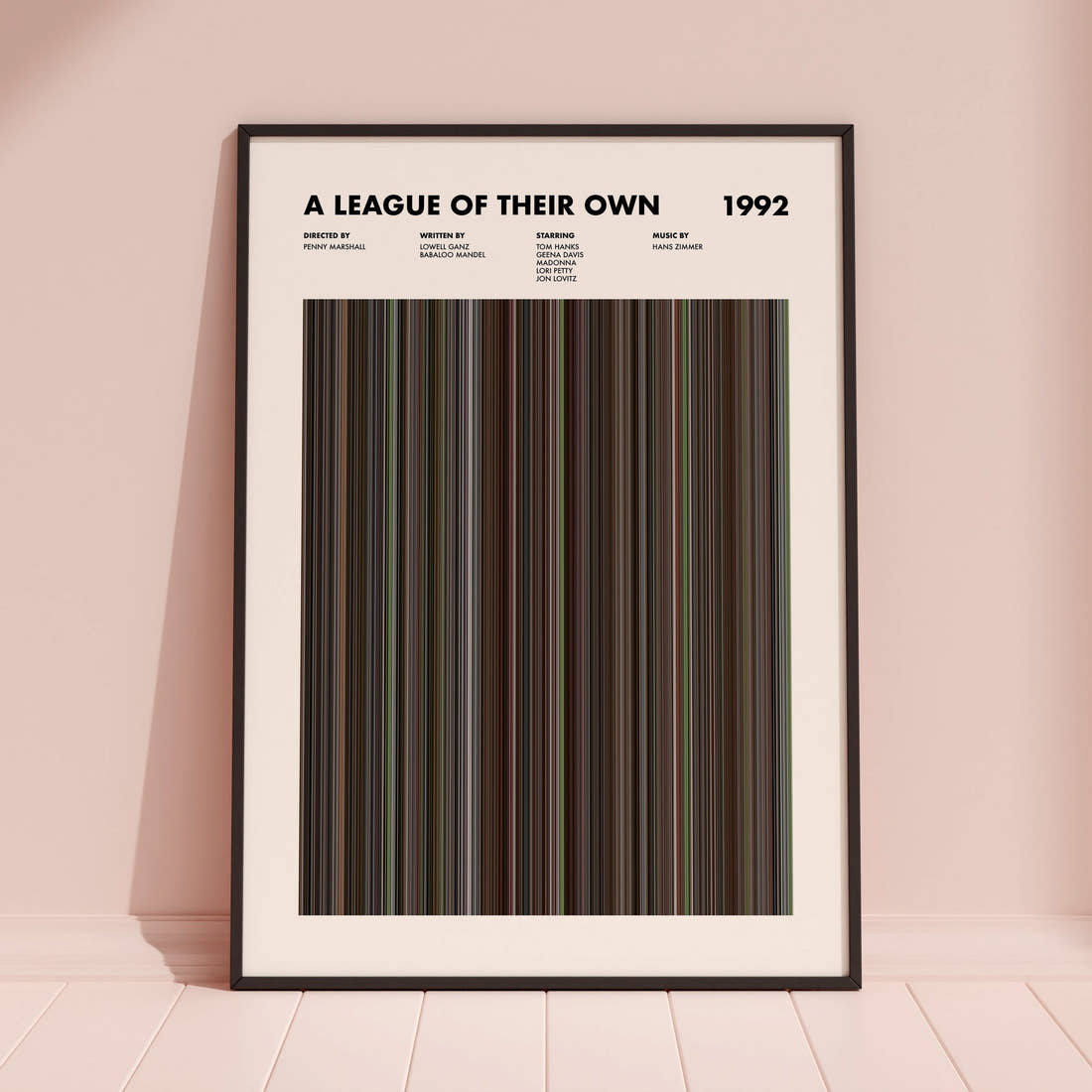 A League of Their Own Movie Barcode Poster framed and leaning against a coloured wall