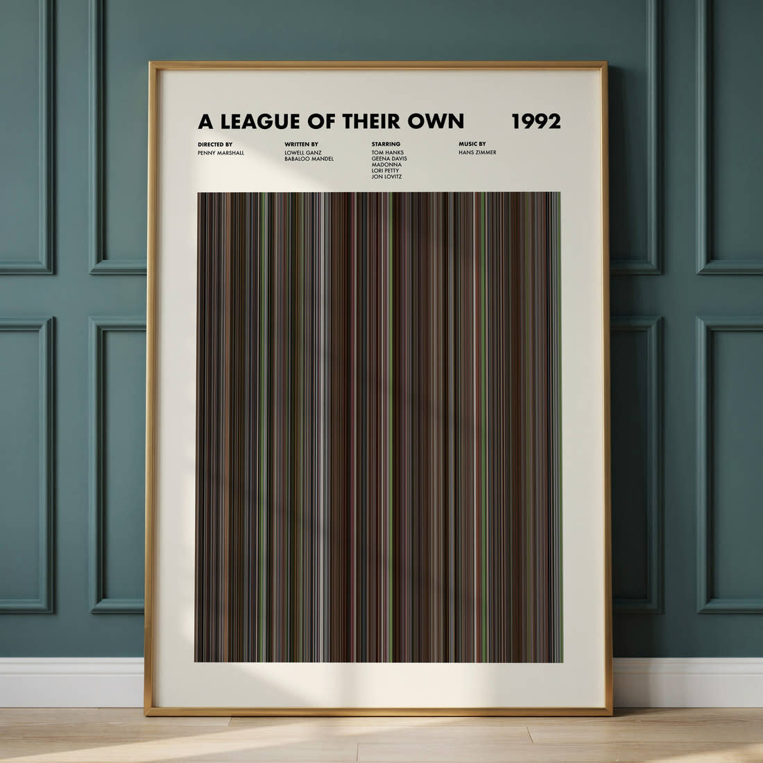 A League of Their Own Movie Barcode Poster framed and leaning against a panelled wall