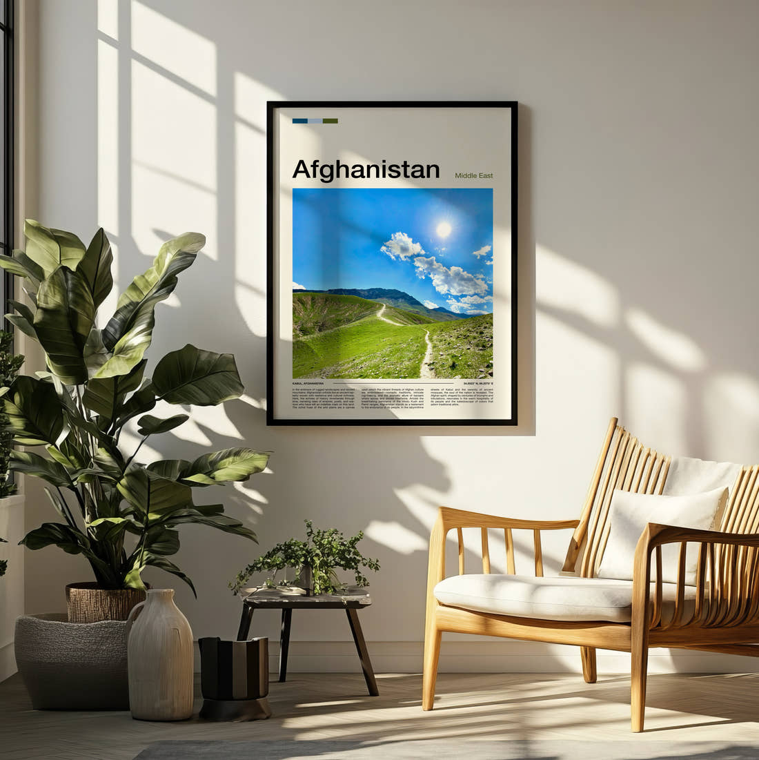 Afghanistan Green Hillside Path Travel Print framed on a pale wall beside houseplants
