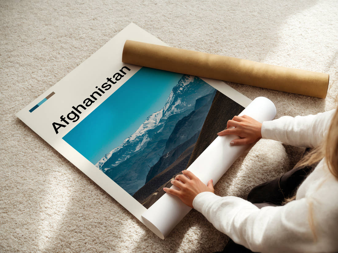 Afghanistan Snow Capped Mountain Range Travel Print being unrolled from its postal tube