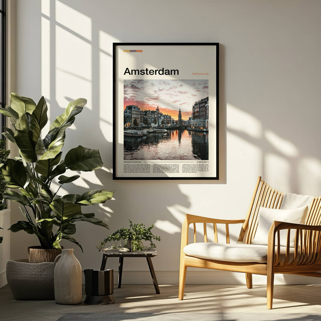 Amsterdam Canal At Sunset Travel Print framed on a pale wall beside houseplants