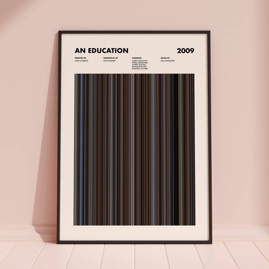 An Education Movie Barcode Poster framed and leaning against a coloured wall