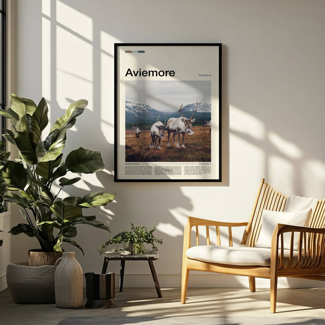 Aviemore Reindeer Travel Print framed on a pale wall beside houseplants