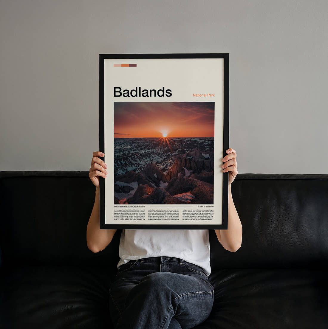Badlands Sunburst Over The Ridges Travel Print held up by hand to show the size of the print