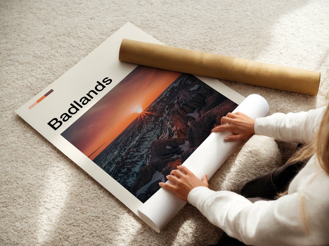 Badlands Sunburst Over The Ridges Travel Print being unrolled from its postal tube