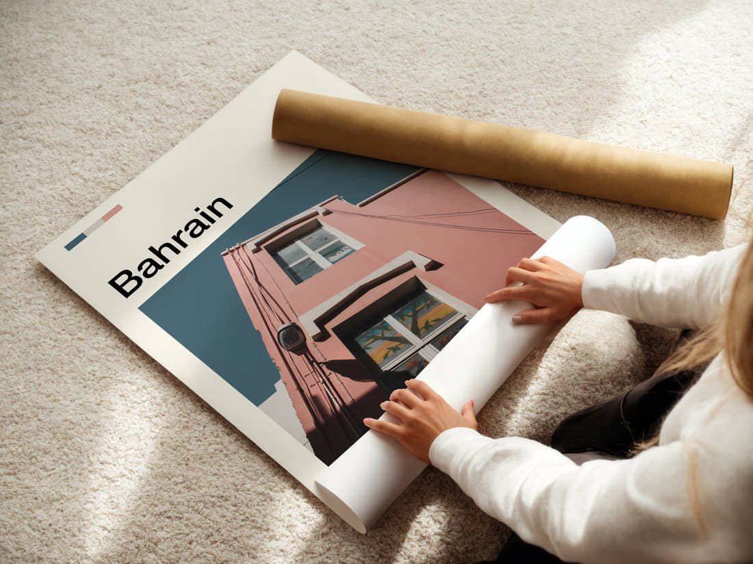 Bahrain Pink Building Facade Travel Print being unrolled from its postal tube
