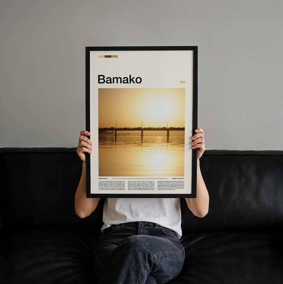Bamako Bridge At Sunset Travel Print held up by hand to show the size of the print