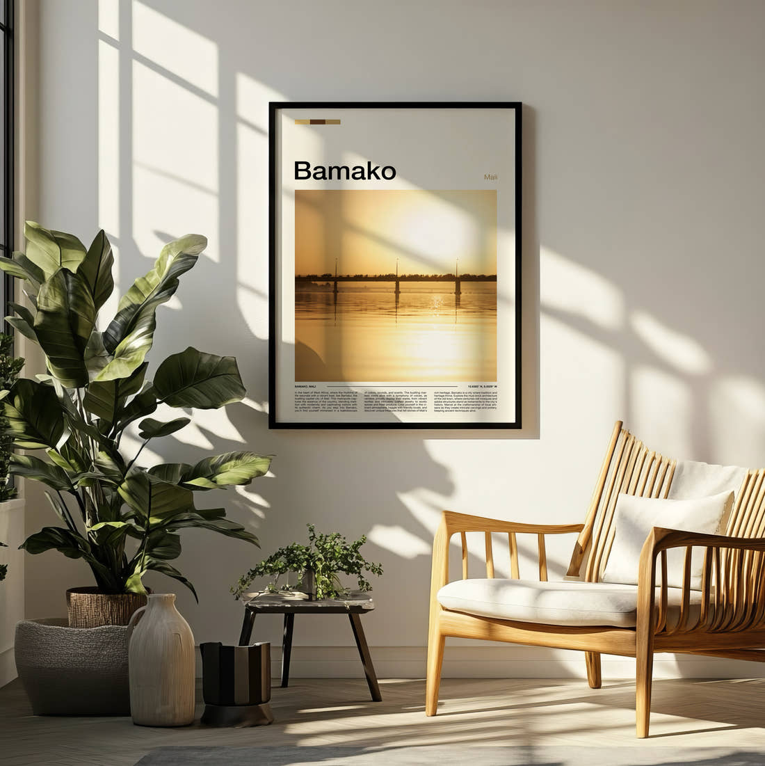 Bamako Bridge At Sunset Travel Print framed on a pale wall beside houseplants