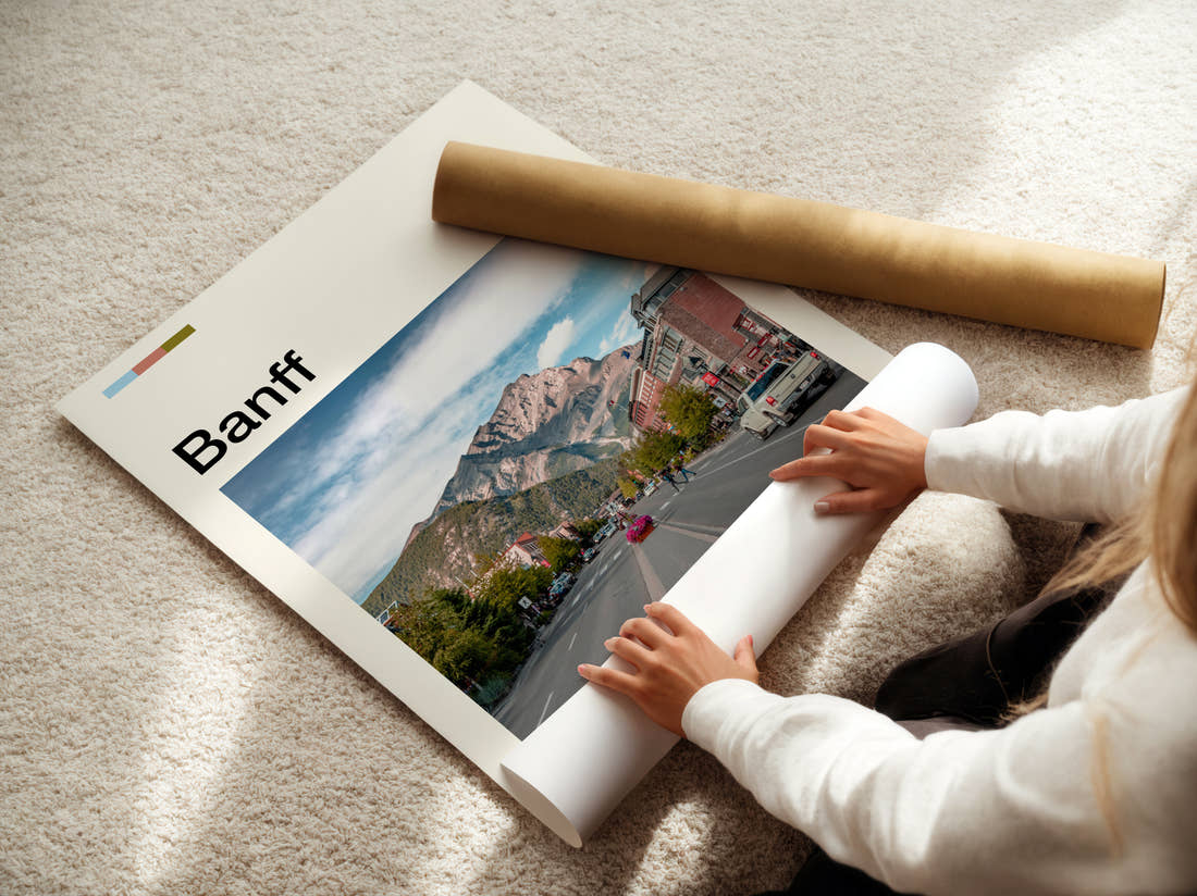 Banff Main Street And Mountain Travel Print being unrolled from its postal tube