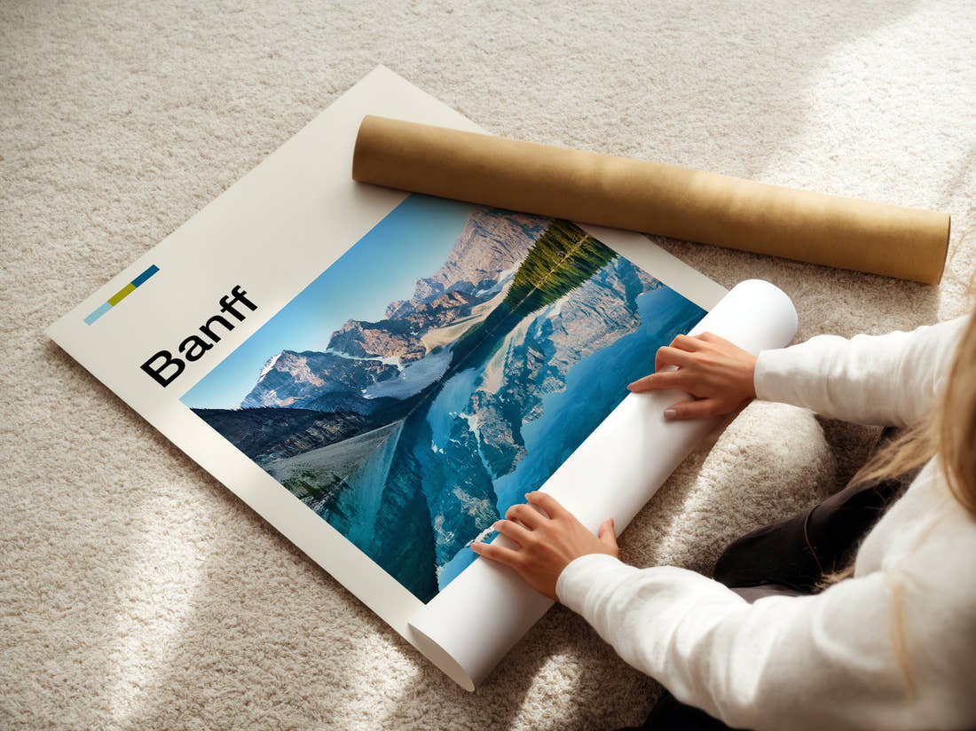 Banff Mountains Reflected In Lake Travel Print being unrolled from its postal tube