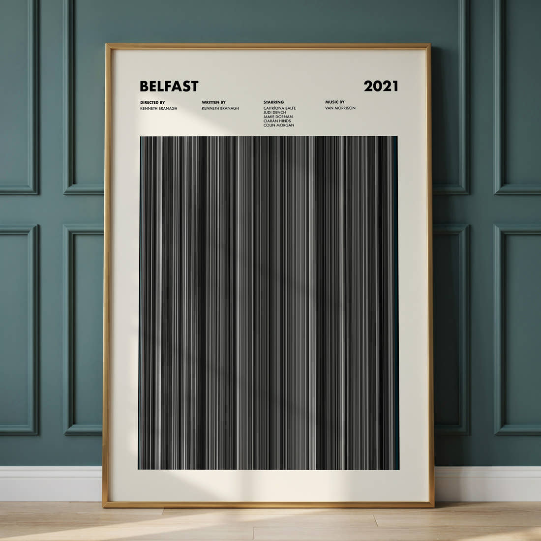 Belfast Movie Barcode Poster framed and leaning against a panelled wall