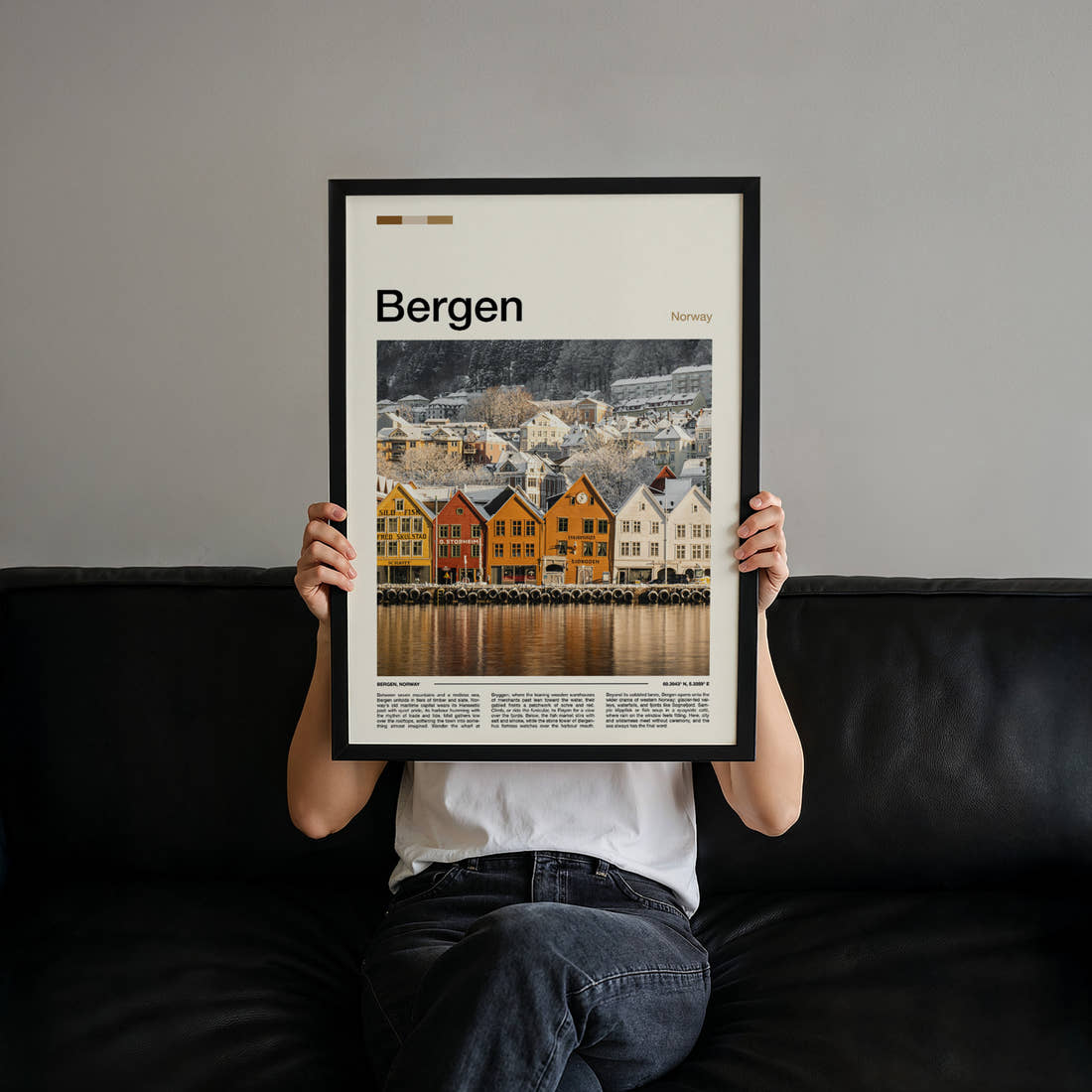 Bergen Snowy Bryggen Wharf Travel Print held up by hand to show the size of the print