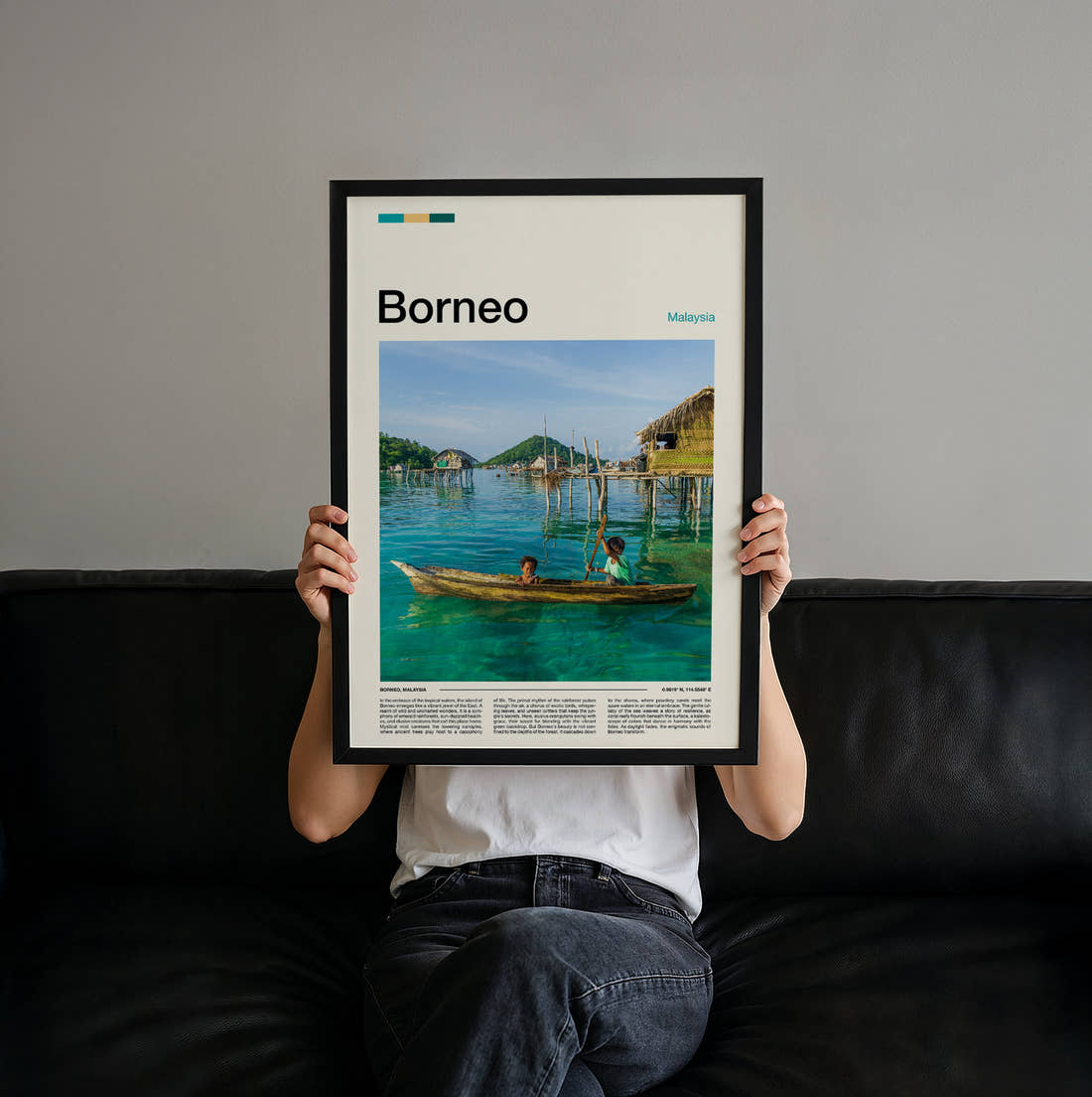 Borneo Children In A Boat Travel Print held up by hand to show the size of the print