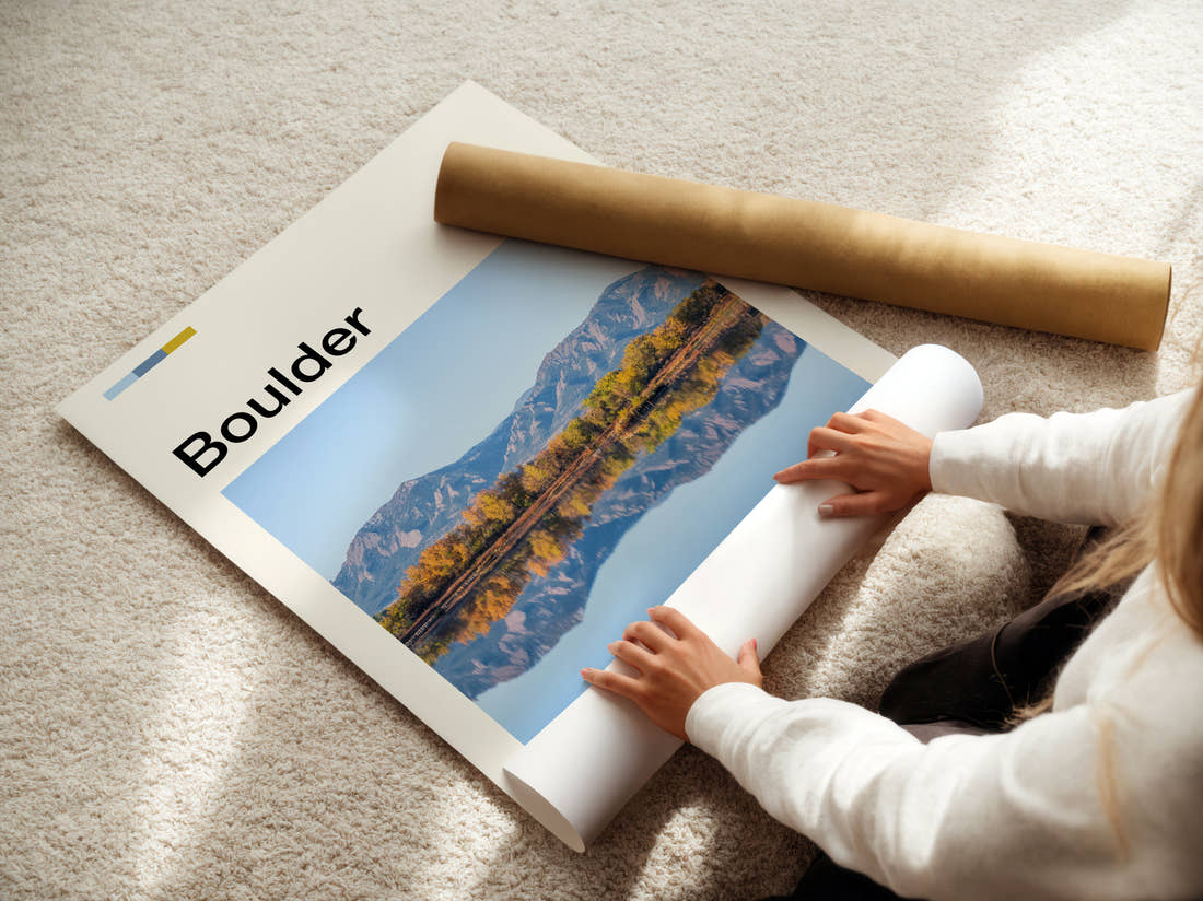 Boulder Mountains Reflected In Water Travel Print being unrolled from its postal tube