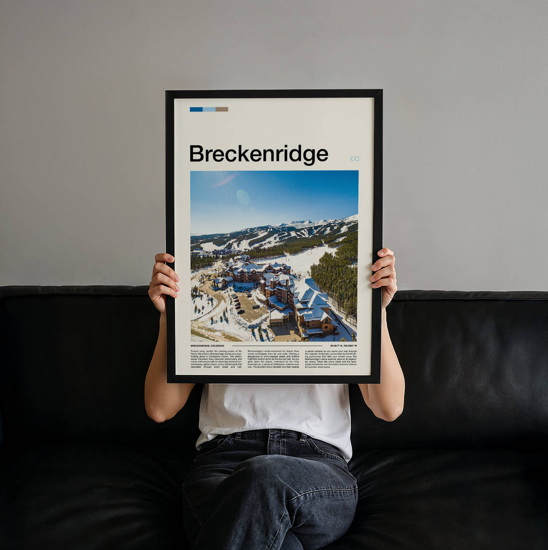 Breckenridge Snowy Resort Village Travel Print held up by hand to show the size of the print