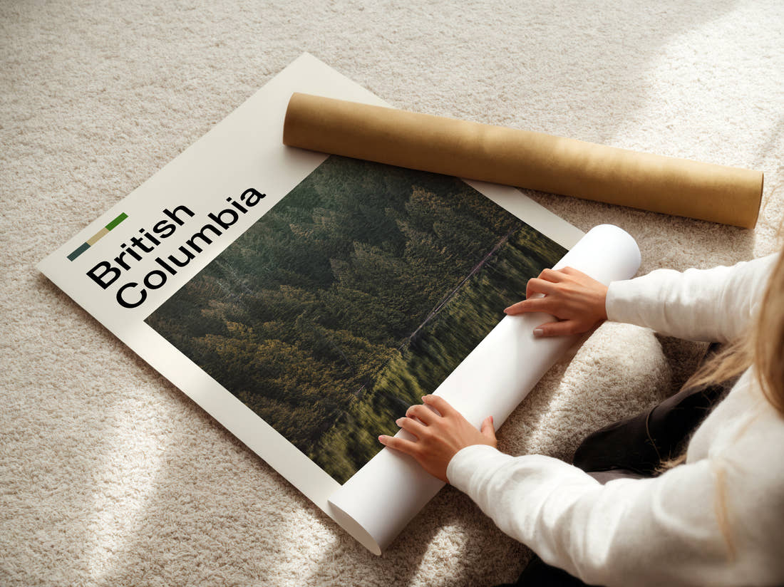 British Columbia Forest Reflected In Lake Travel Print being unrolled from its postal tube
