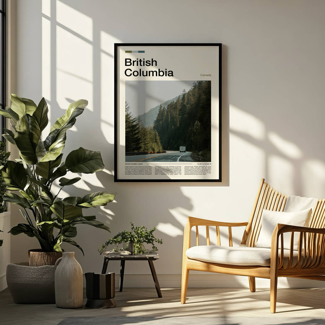 British Columbia Road Through The Forest Travel Print framed on a pale wall beside houseplants