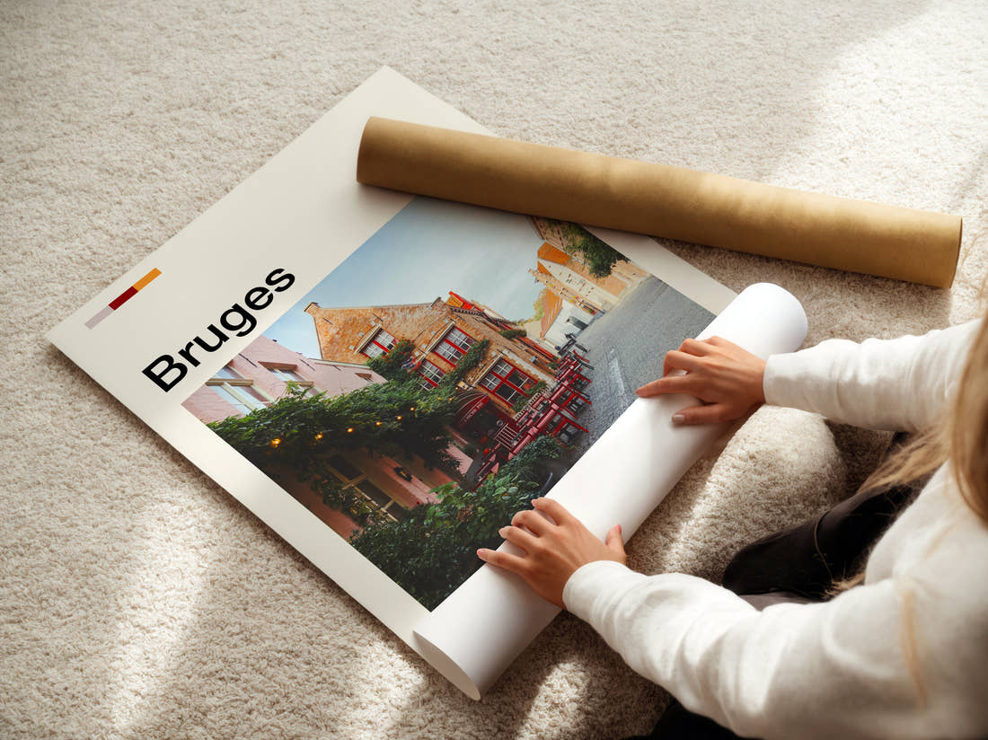 Bruges Cafe With Red Chairs Travel Print being unrolled from its postal tube