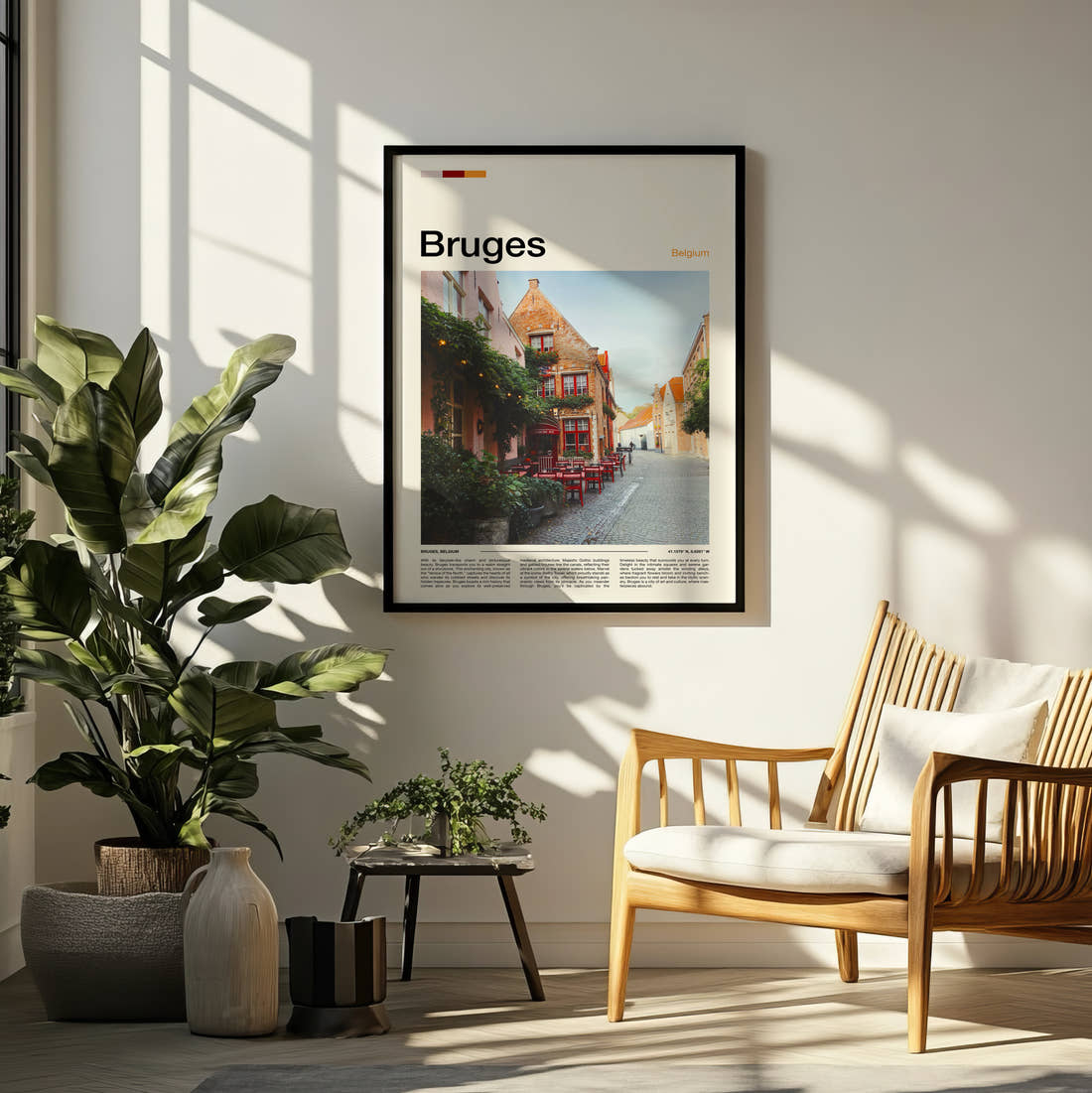 Bruges Cafe With Red Chairs Travel Print framed on a pale wall beside houseplants