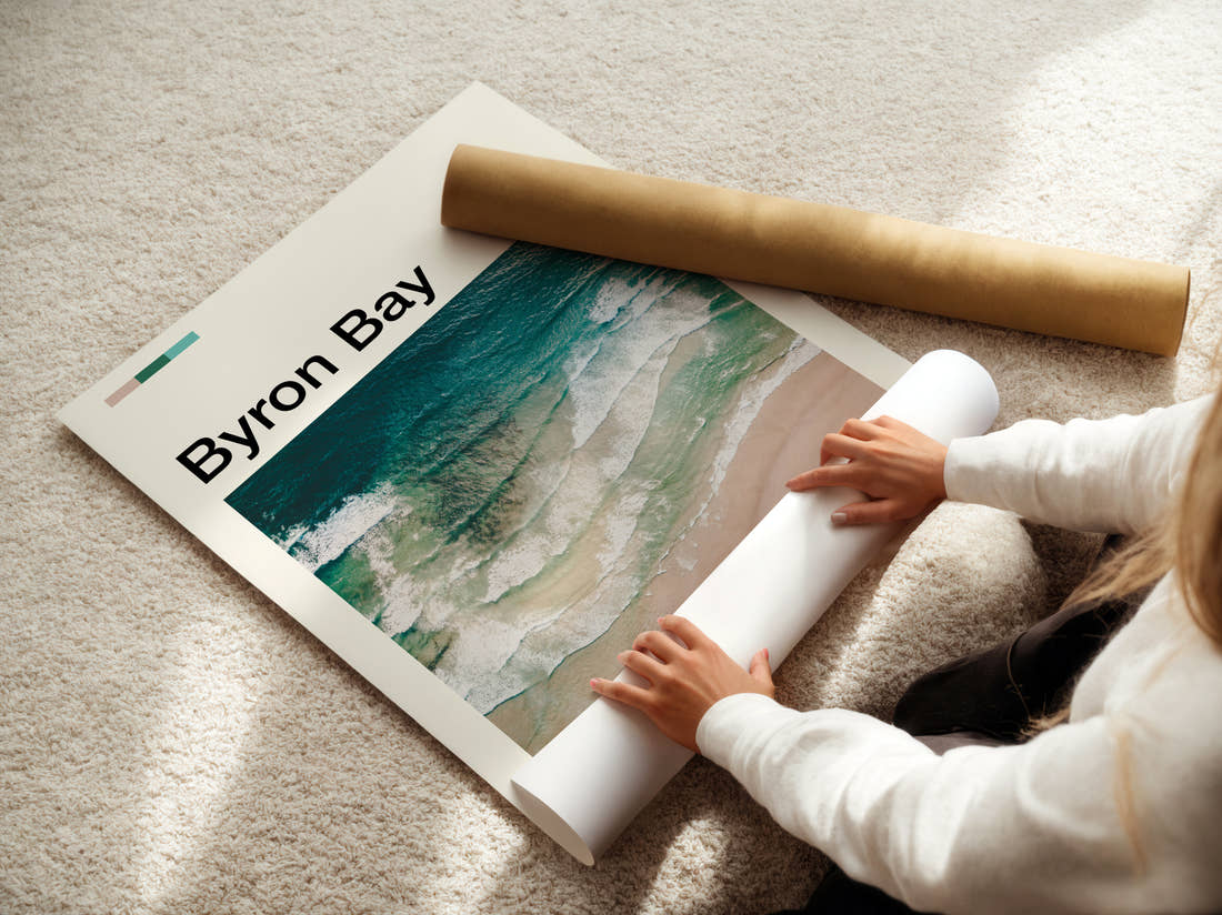 Byron Bay Waves On The Shore Travel Print being unrolled from its postal tube