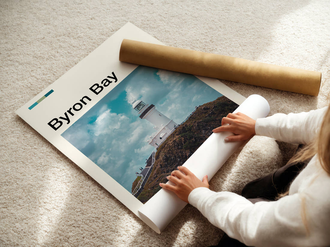 Byron Bay Clifftop Lighthouse Travel Print being unrolled from its postal tube