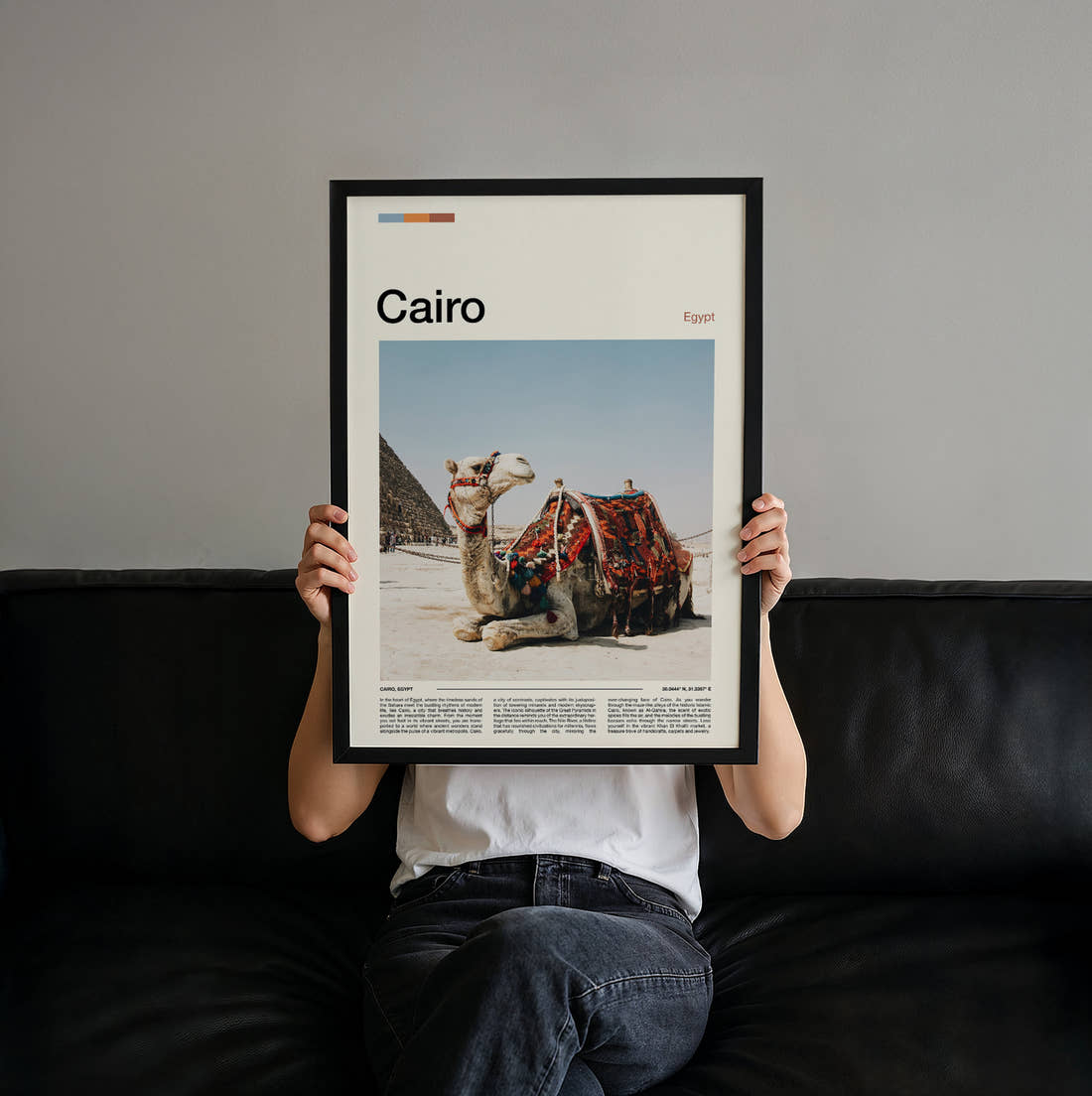 Cairo Camel And Pyramid Travel Print held up by hand to show the size of the print