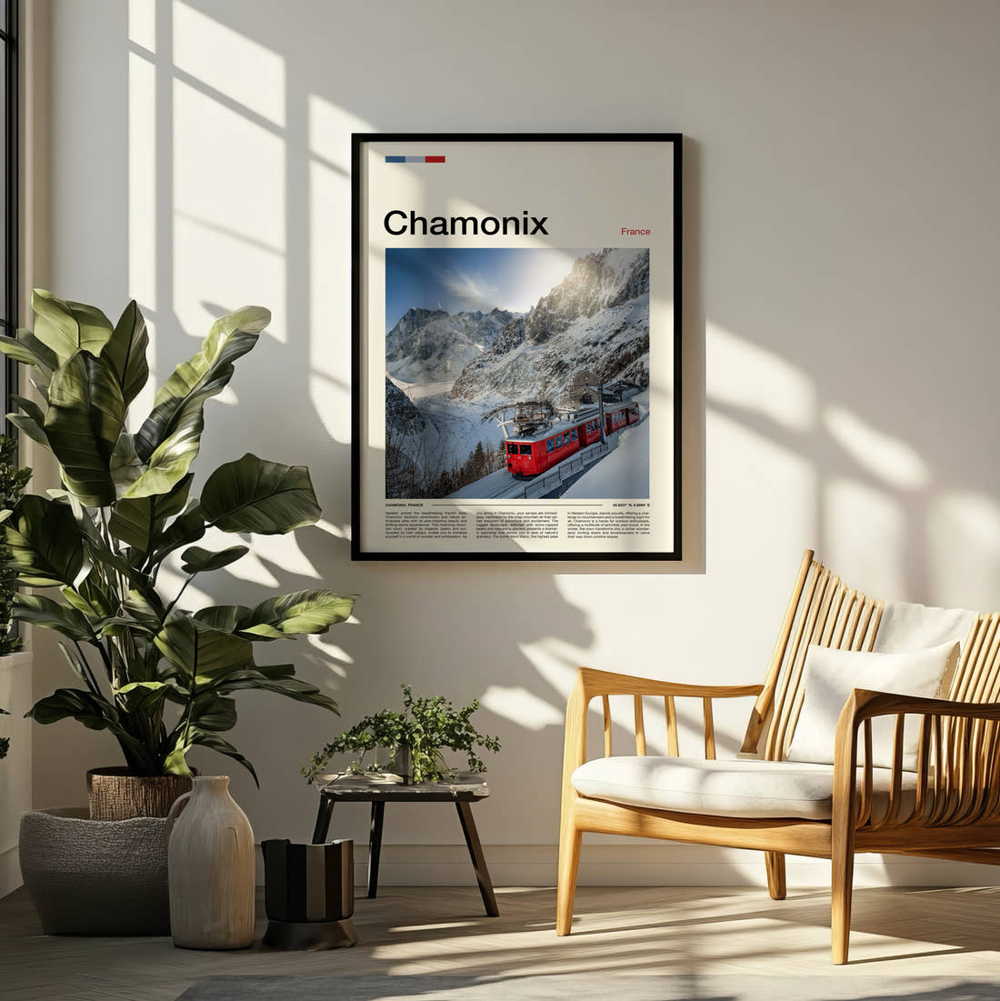 Chamonix Red Mountain Train Travel Print framed on a pale wall beside houseplants
