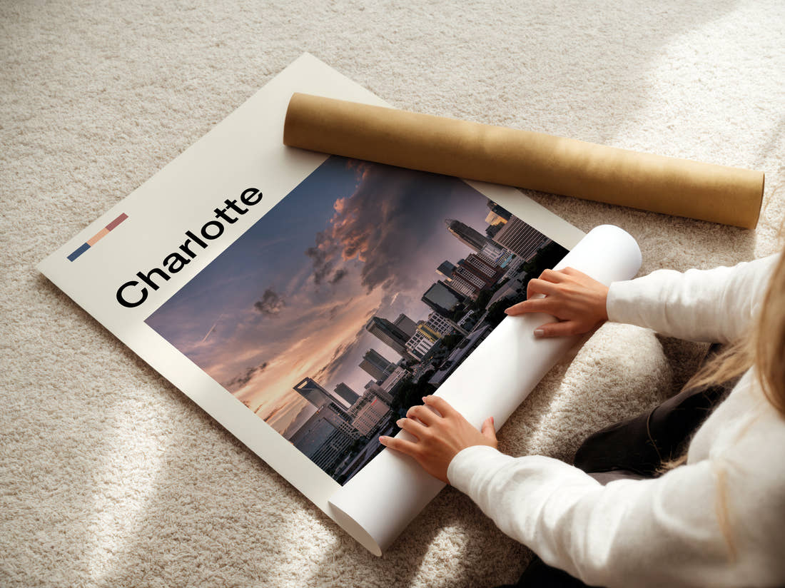 Charlotte Stormy Skyline Travel Print being unrolled from its postal tube