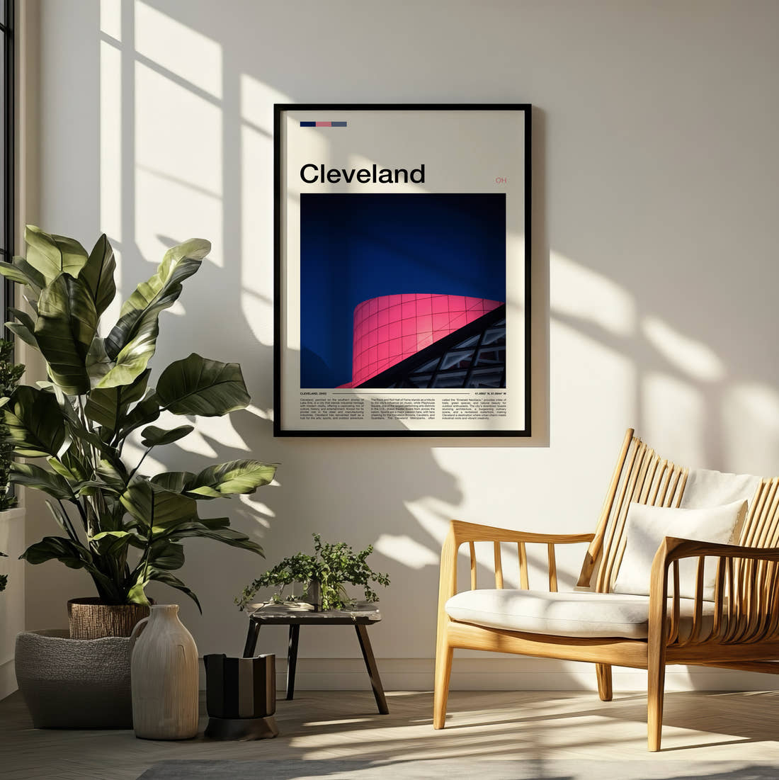 Cleveland Pink Glass Facade Travel Print framed on a pale wall beside houseplants