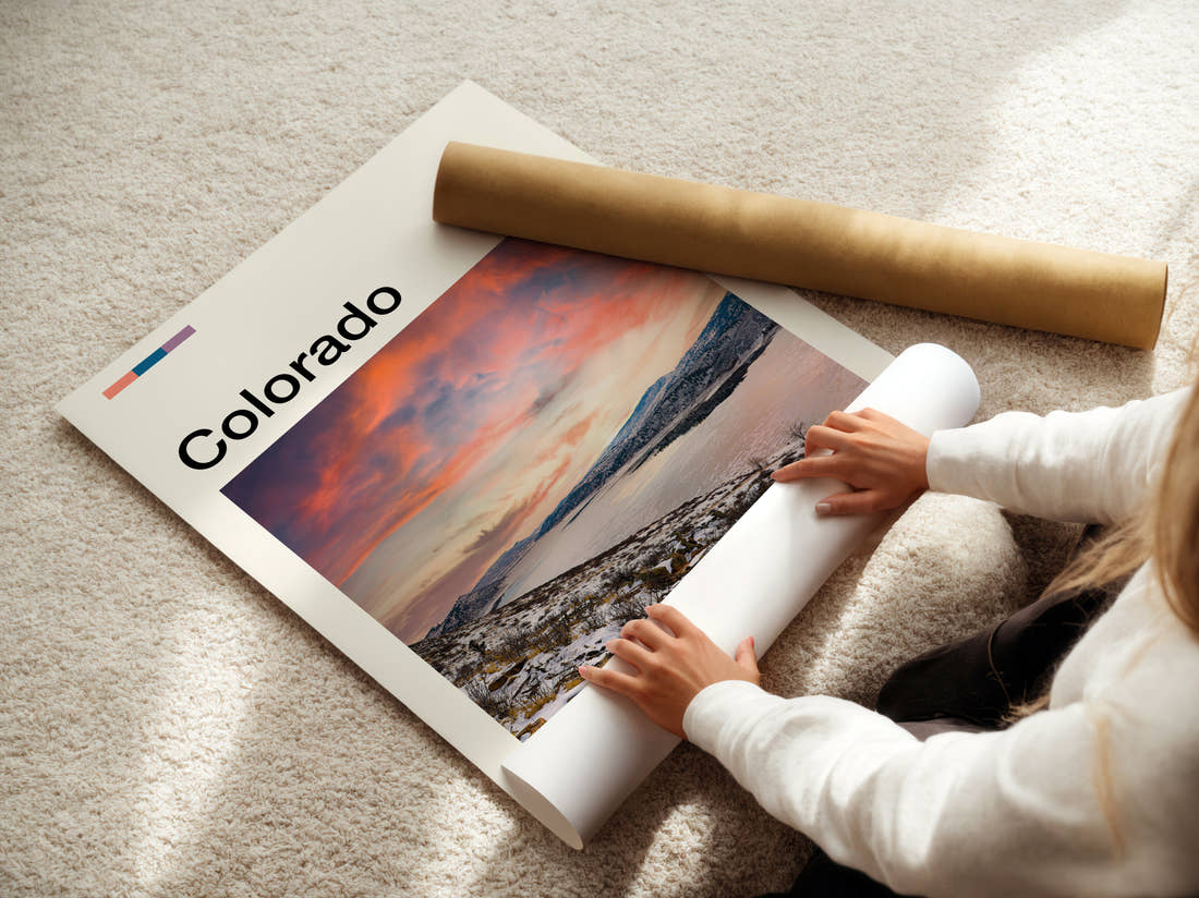 Colorado Snowy Lake At Sunset Travel Print being unrolled from its postal tube