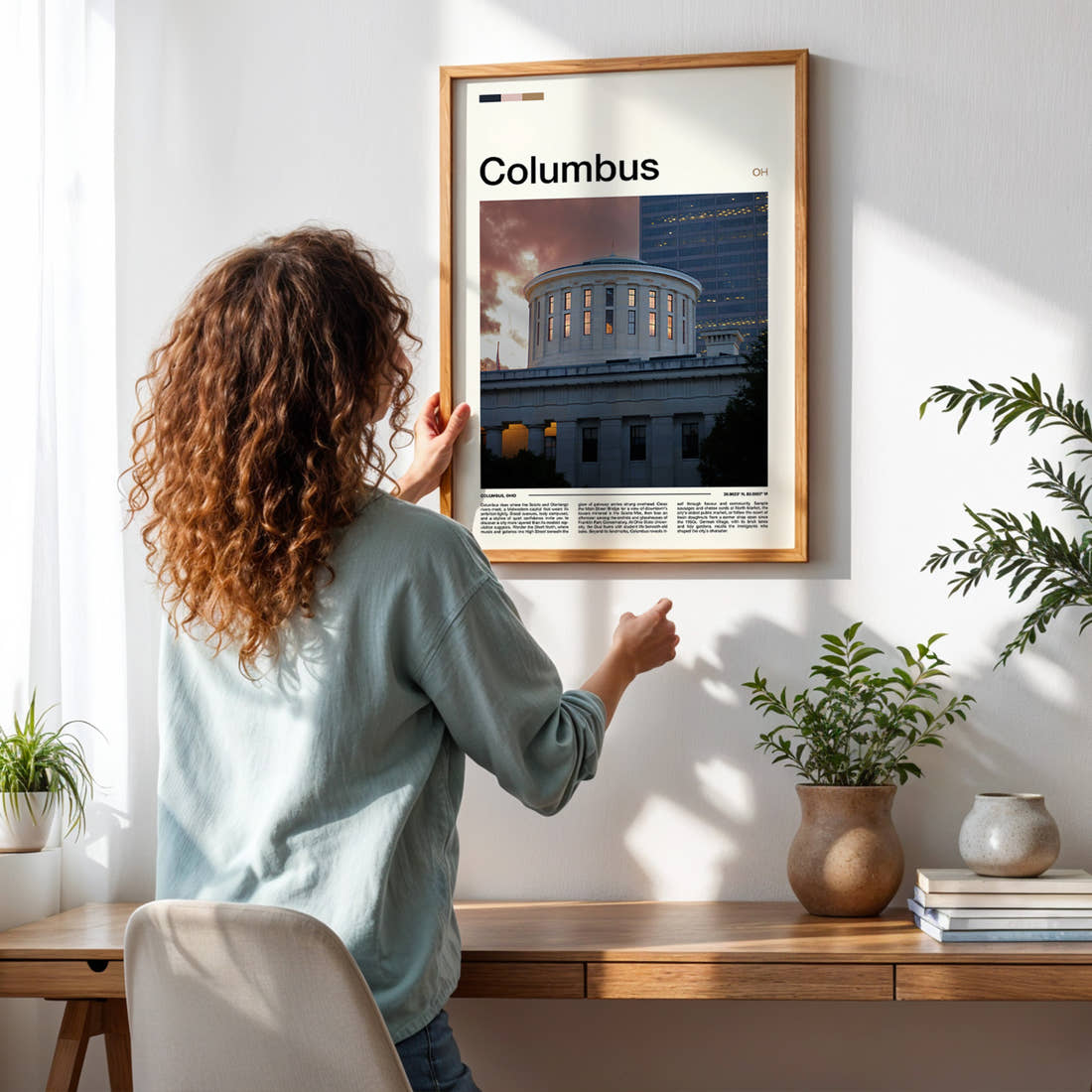 Columbus Statehouse Rotunda Dusk Travel Print framed on a pale wall beside houseplants