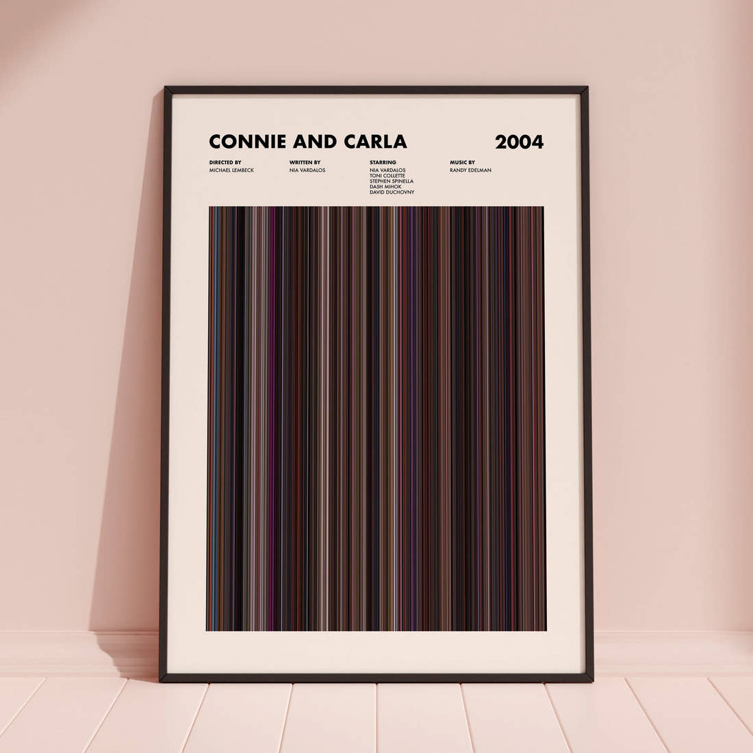 Connie and Carla Movie Barcode Poster framed and leaning against a coloured wall