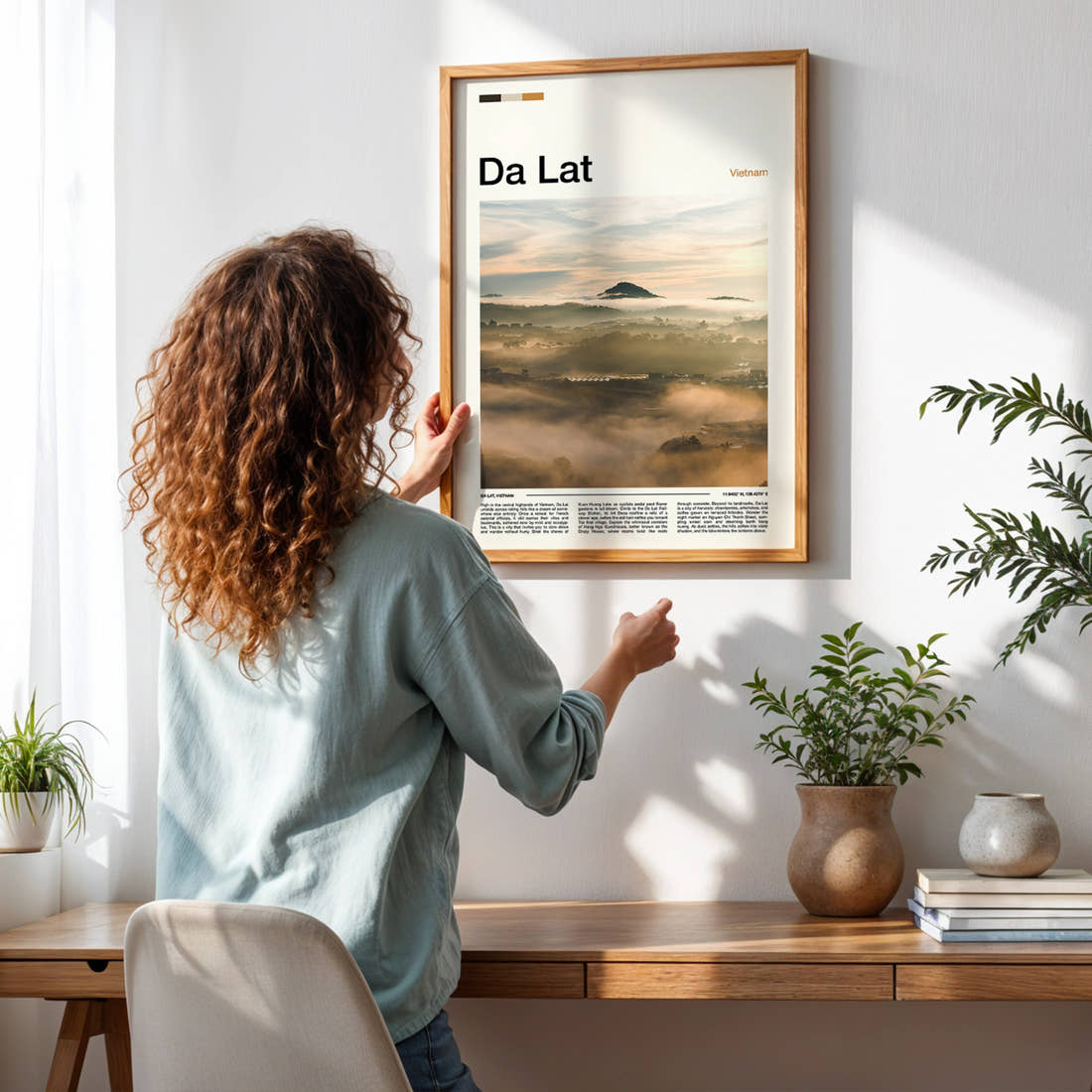 Da Lat Misty Highland Valley Travel Print framed on a pale wall beside houseplants
