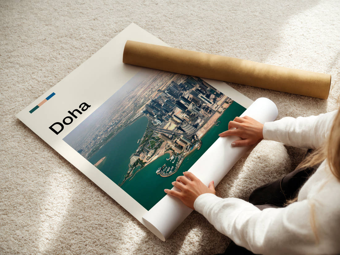 Doha Skyline From The Air Travel Print being unrolled from its postal tube