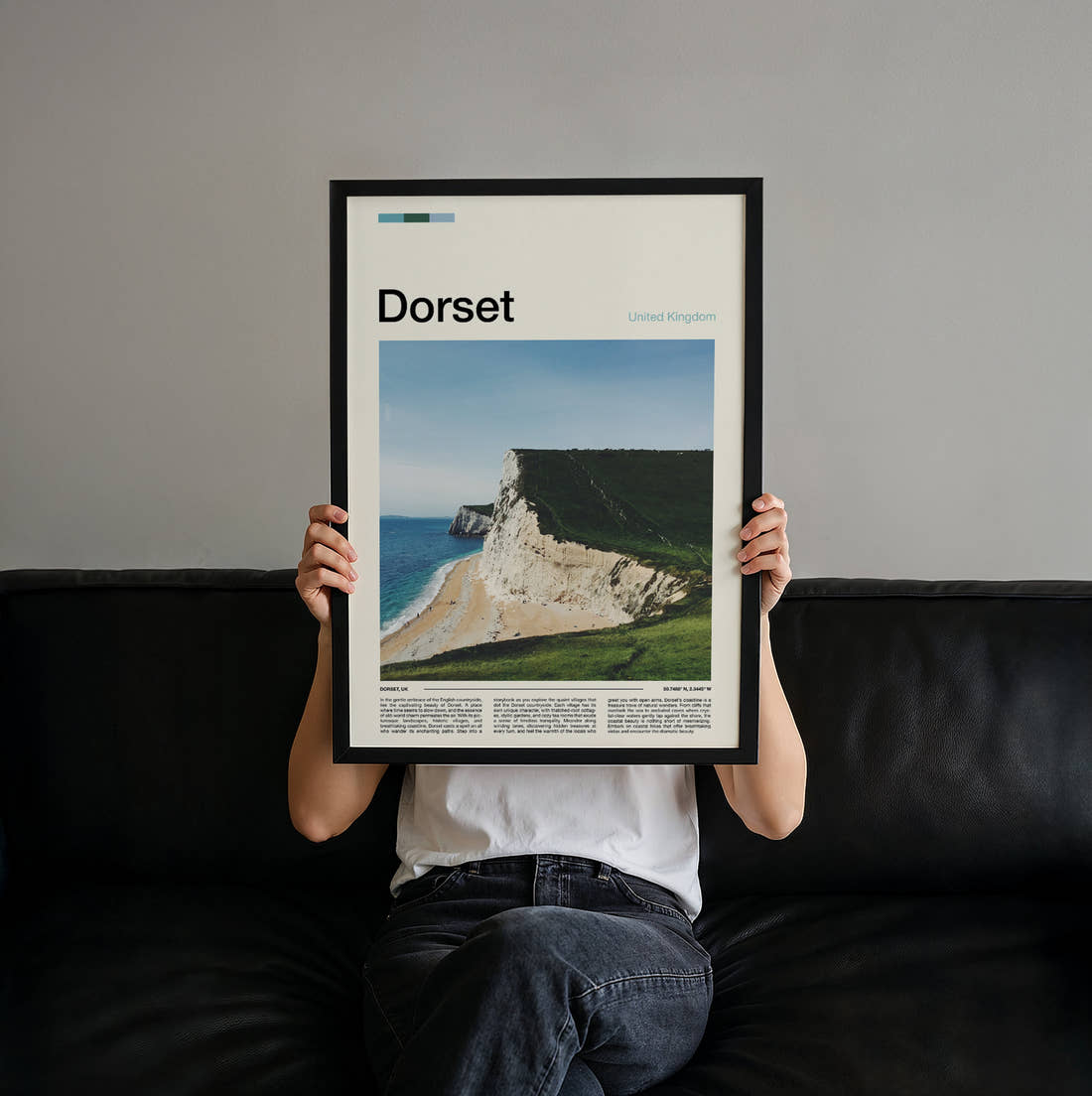 Dorset White Chalk Cliffs Travel Print held up by hand to show the size of the print