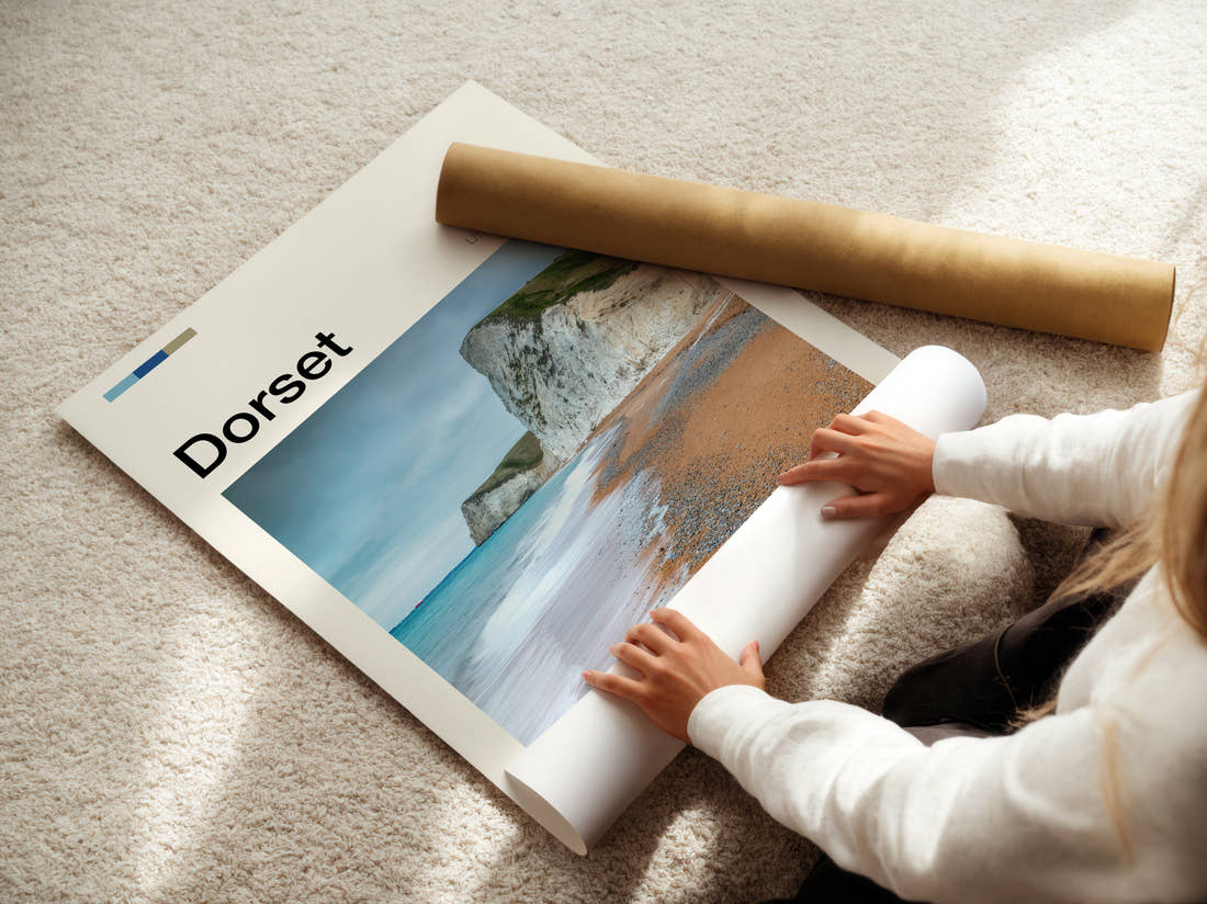 Dorset Chalk Cliffs And Beach Travel Print being unrolled from its postal tube