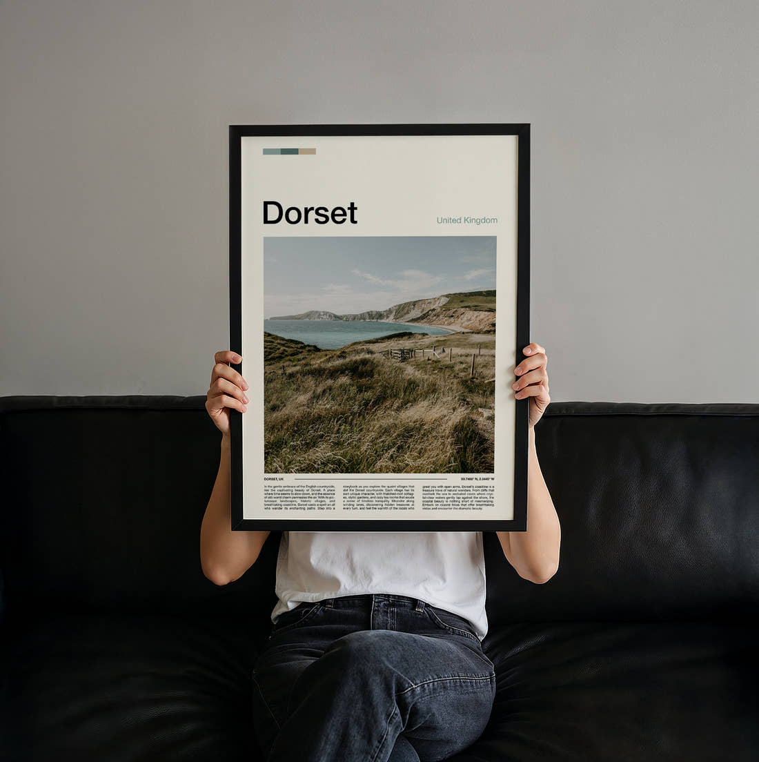 Dorset Clifftop Over The Bay Travel Print held up by hand to show the size of the print