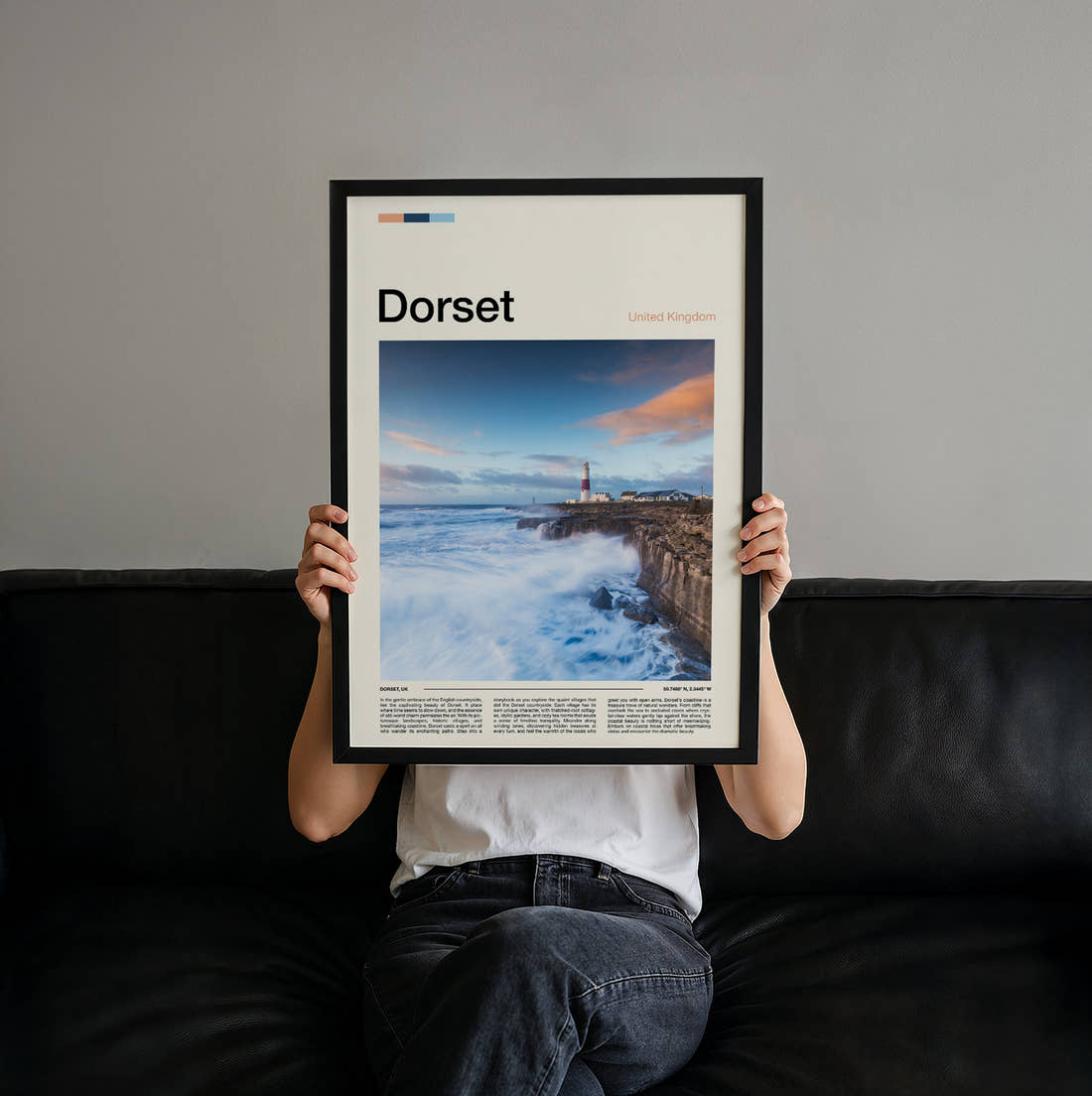 Dorset Lighthouse On The Pier Travel Print held up by hand to show the size of the print