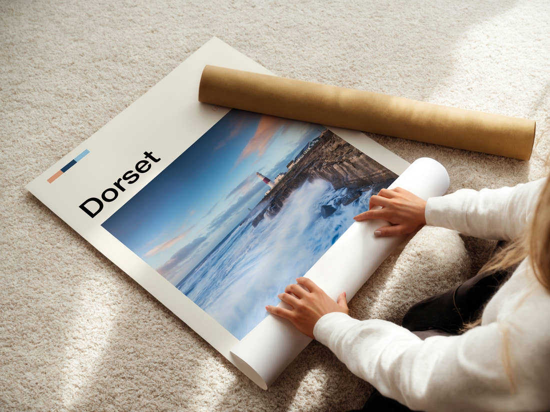 Dorset Lighthouse On The Pier Travel Print being unrolled from its postal tube