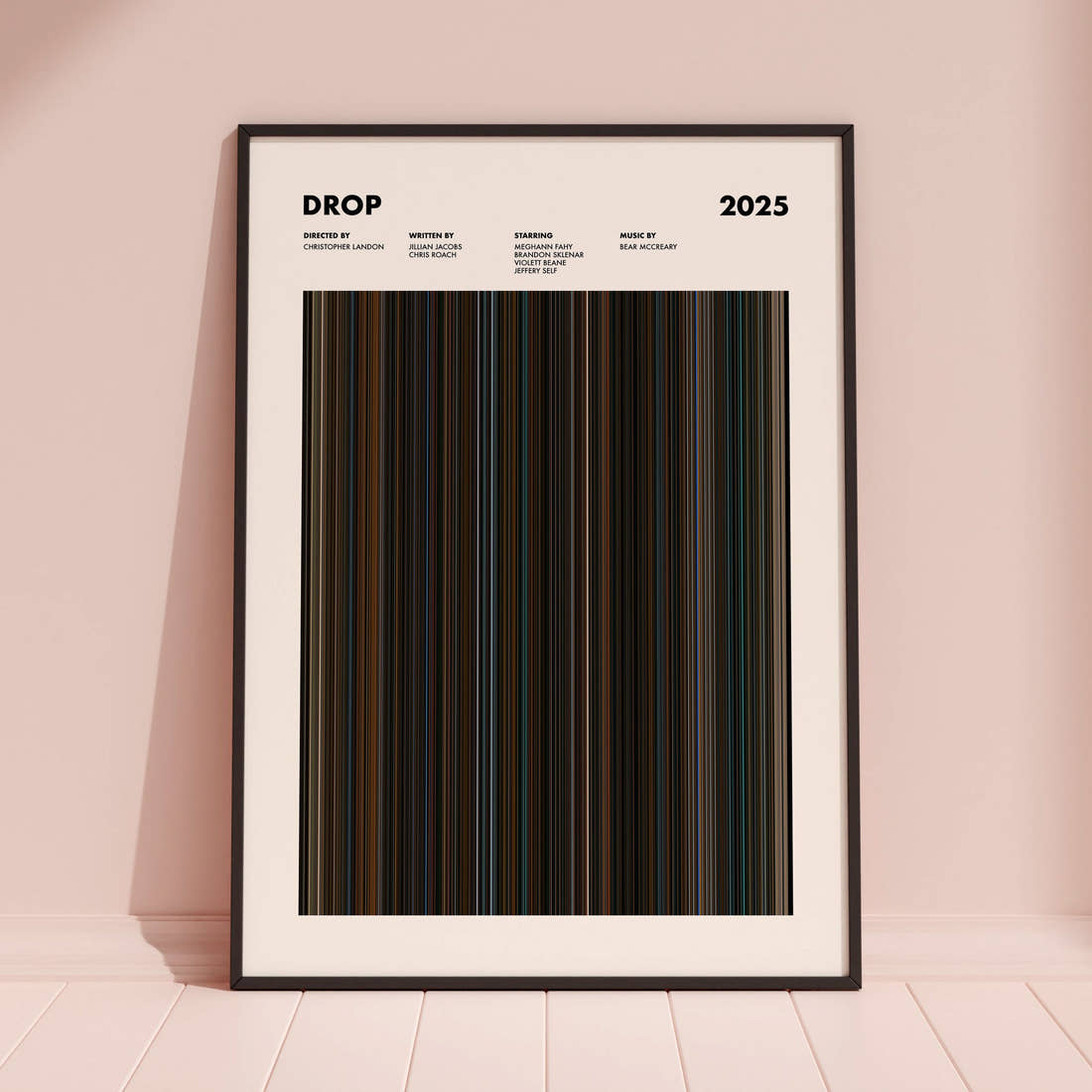 Drop Movie Barcode Poster framed and leaning against a coloured wall
