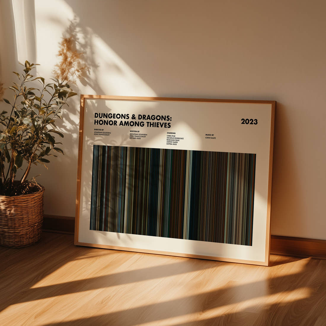 Dungeons and Dragons Honor Among Thieves Movie Barcode Poster framed and leaning against a wall on a wooden floor