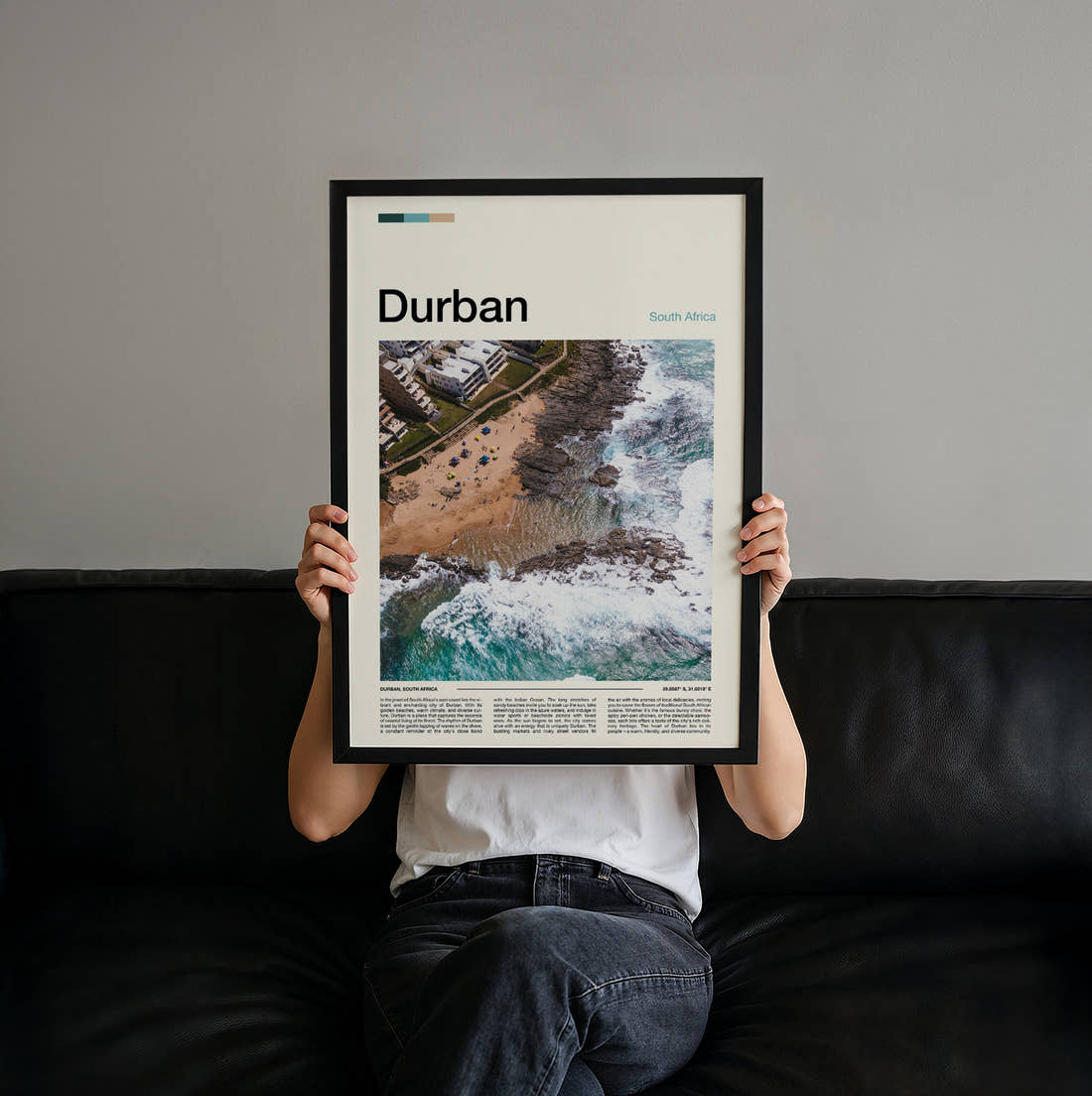 Durban Coastline From Above Travel Print held up by hand to show the size of the print