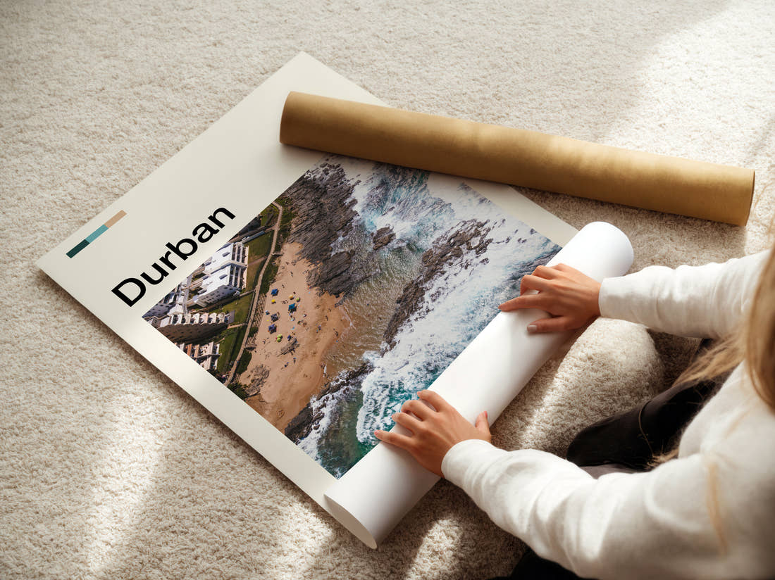 Durban Coastline From Above Travel Print being unrolled from its postal tube