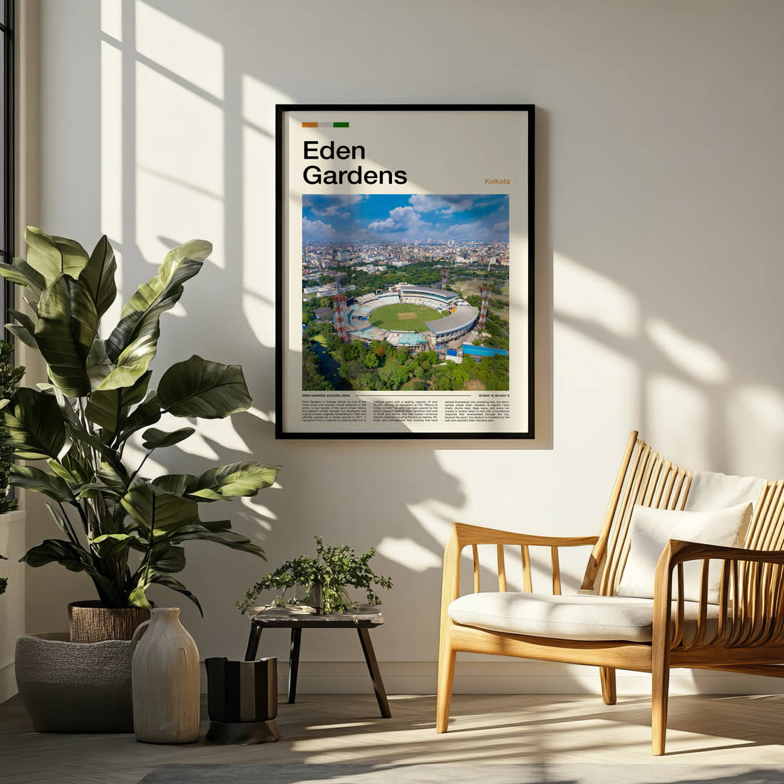 Eden Gardens Stadium Print framed on a pale wall beside houseplants