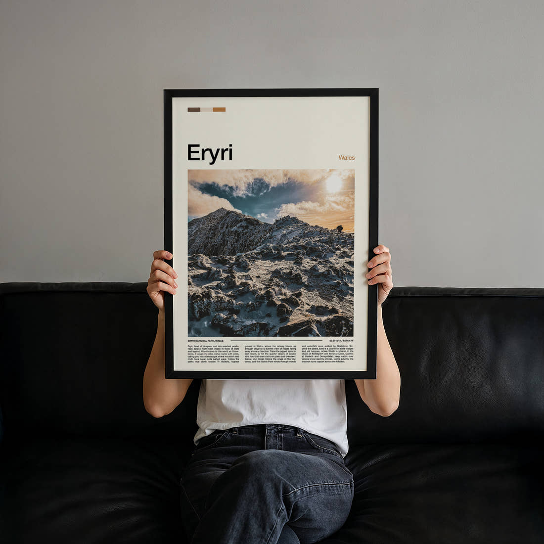 Eryri Snow-Capped Ridge Travel Print held up by hand to show the size of the print