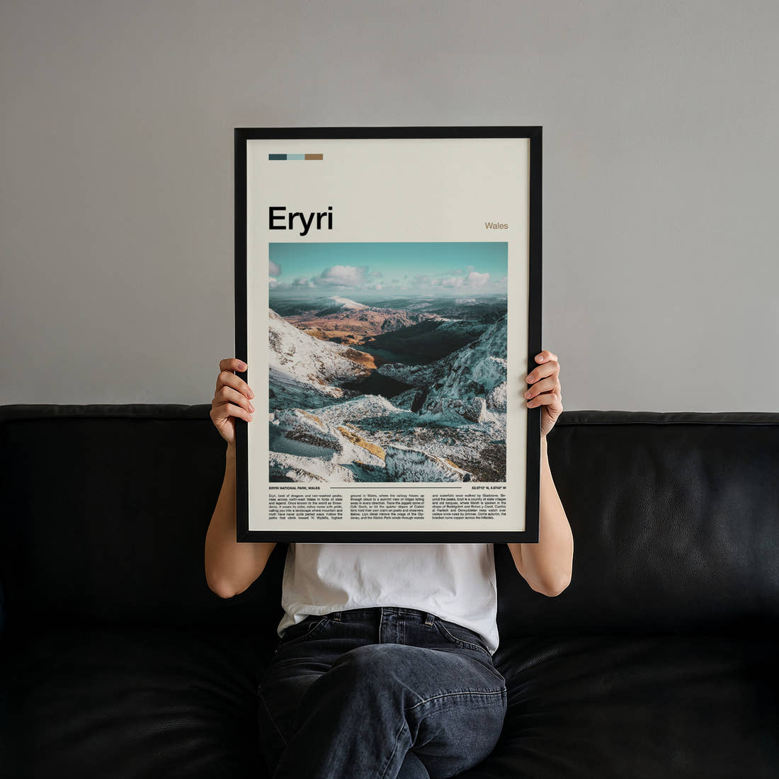 Eryri Snow-Dusted Mountain Valley Travel Print held up by hand to show the size of the print