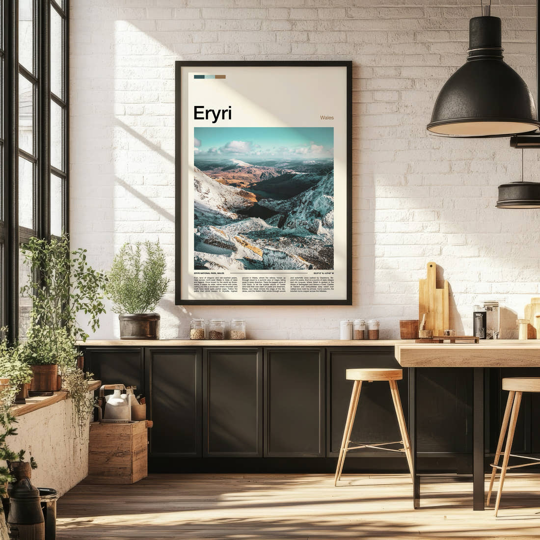 Eryri Snow-Dusted Mountain Valley Travel Print framed on the wall of a bright kitchen and dining space