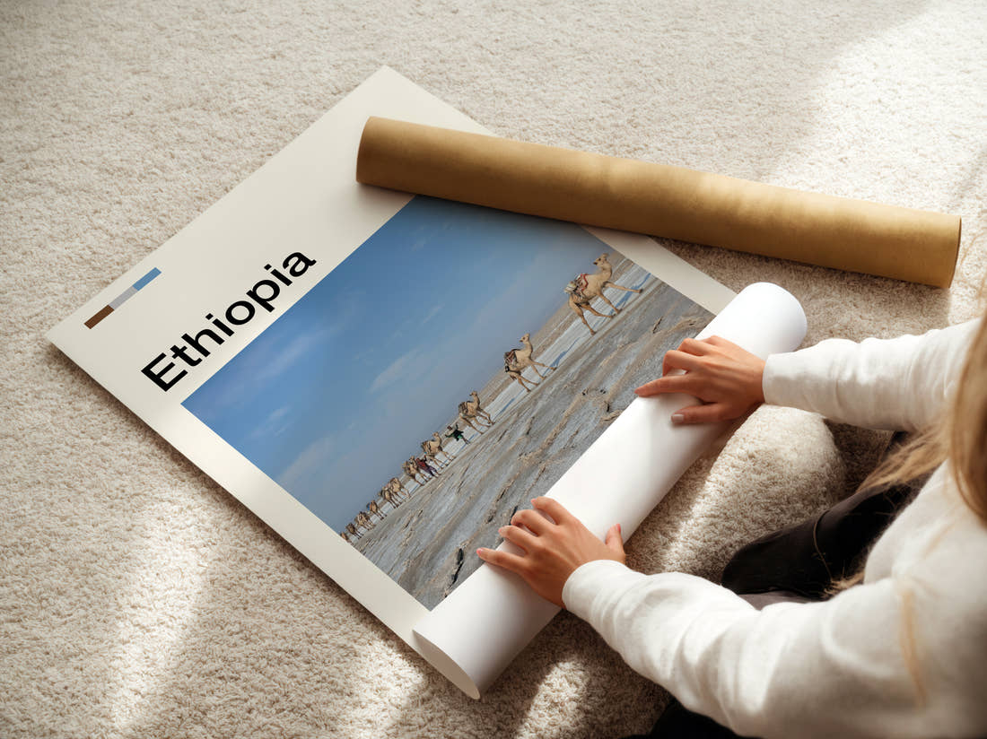 Ethiopia Camels On Salt Flats Travel Print being unrolled from its postal tube