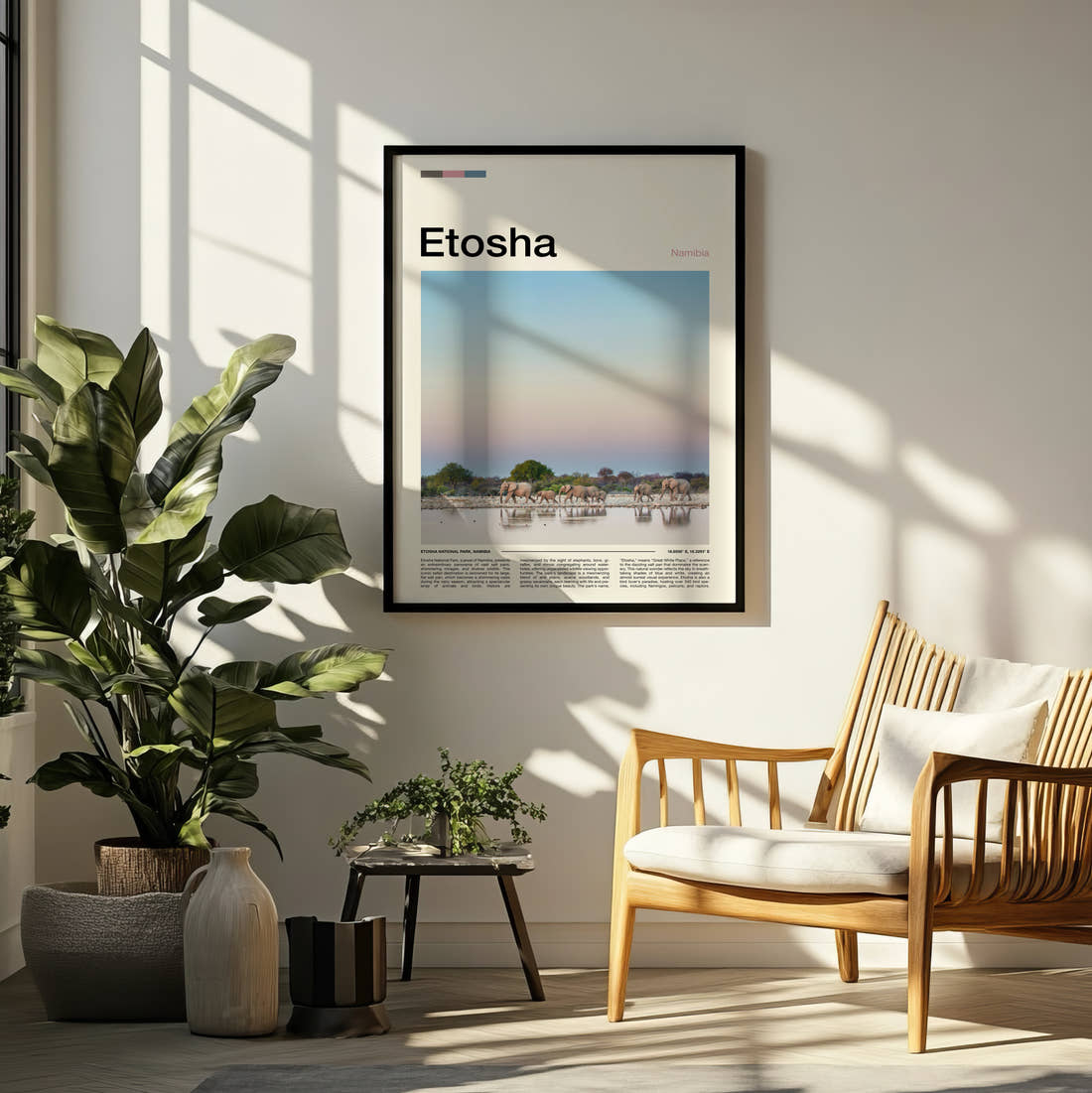 Etosha Elephants At The Waterhole Travel Print framed on a pale wall beside houseplants